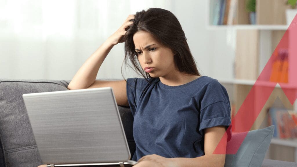 A woman holding a laptop and her head
