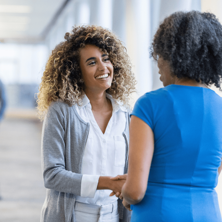 job candidate shaking hands with hiring manager
