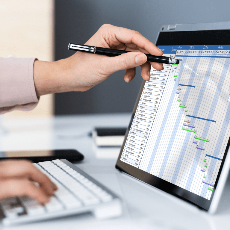 computer monitor with project management software displayed on in